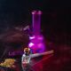 composition-smoking-accessories-with-pipe-pile-weed-purple-glass-bong-still-life_274234-16405