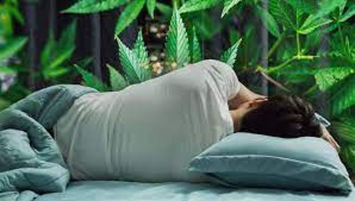 man sleeping on his side with a marijuana background
