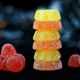 live resin gummies stacked against a dark background